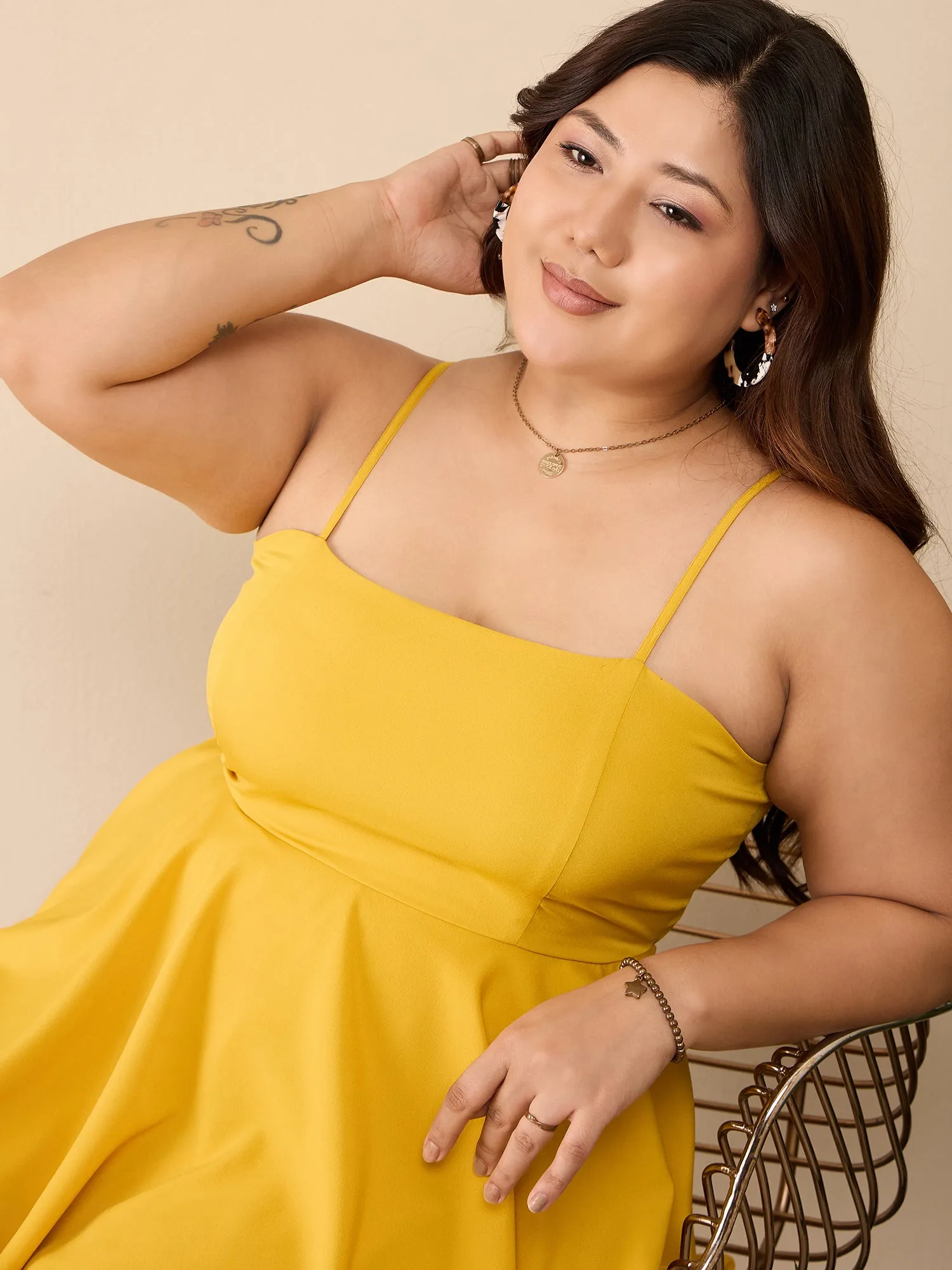 Berrylush Curve Women Solid Yellow Square Neck Sleeveless Back Cutout Tie-Up Layered Mini Jumpsuit